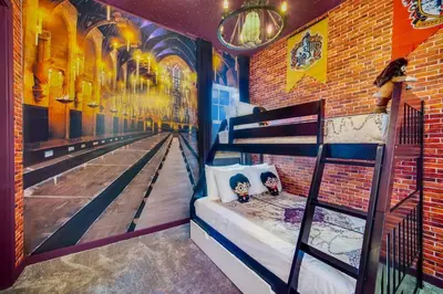a room with a bowling alley mural on the wall at 3BD 3BA Themed House Near Disney in Orlando
