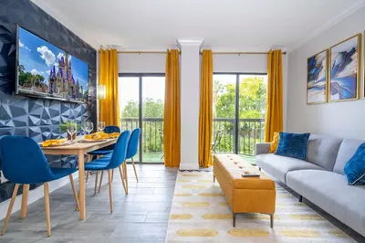 a living room with a couch and a table at Cozy apt 2 bedrooms 1 mile Universal Studios in Orlando
