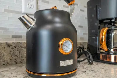a black tea kettle sitting on a kitchen counter at A Galaxy’s Edge Experience Awaits 5 Min to Disney in Orlando