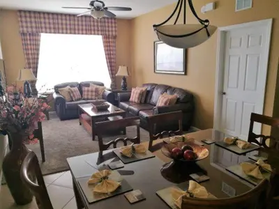 a living room with a couch and a table at POOL VIEW 3 Bedroom Condo at Windsor Hills 'The Lido Deck' in Orlando