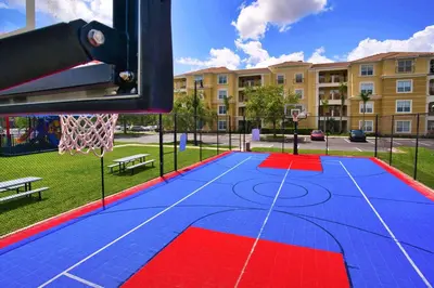 a basketball hoop in a park with a building at The Epic Boca Penthouse Vista Cay Orlando in Orlando