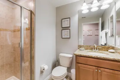 a bathroom with a shower and a toilet and a sink at Palms of Paradise! in Kissimmee