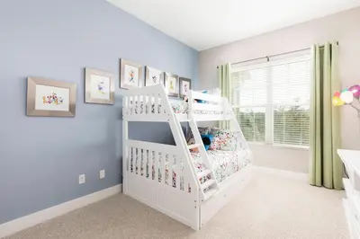 a white bunk bed in a childs room at Cozy Beautiful 5 Suites close to Disney World in Orlando