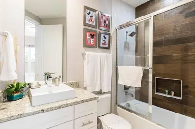 a bathroom with a sink toilet and a shower at Cozy Beautiful 5 Suites close to Disney World in Orlando