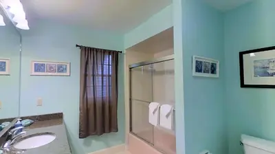 a bathroom with a shower and a sink at 3 Bed 2 Bath amazing Lakeview , Jacuzzi Bath Tub in Oviedo