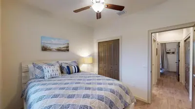a bedroom with a bed and a ceiling fan at Quiet 2 Bed Cottage in Oviedo w Resort Discounts in Oviedo