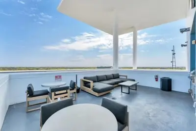 a living room with a couch and chairs and a table at Lovely 2Bdrm 2Bath Thorton Park Condo with secure parking in Orlando