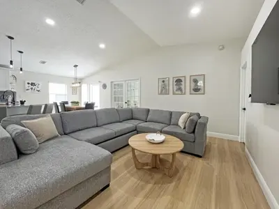 a living room with a couch and a table at Stardust Villa home in Kissimmee
