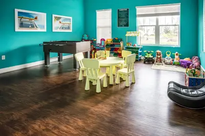a room with a table and chairs and a piano at Elegant, Spacious 3bedroom Near Attractions Hot Tub Pool & Gym in Kissimmee
