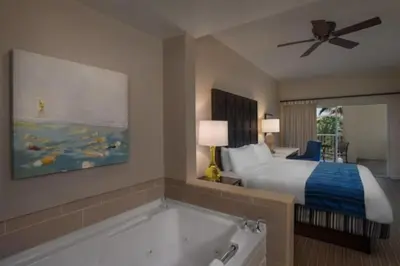 a hotel room with a bed and a bath tub at Marriott Grande Vista Luxury 1BD villa sleeps 4 in Orlando