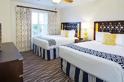 a hotel room with two beds and a window at Enjoy your AM coffee in resort relaxation garden in this great 1BD condo in Orlando in Orlando