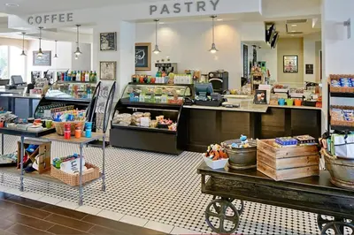 a coffee shop with aasteryasteryasteryasteryasteryasteryasteryasteryasteryasteryastery at Enjoy your AM coffee in resort relaxation garden in this great 1BD condo in Orlando in Orlando