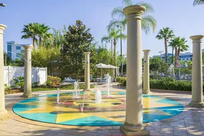 a fountain in a park with palm trees at Take the Family to Orlando in this great 2BD in a resort setting with tons of amenities in Orlando