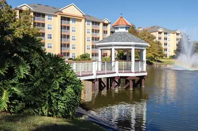a gazebo on the water in front of a building at Relax after the Orlando parks in this 1BD resort condo with pools, restaurants, activities etc in Orlando