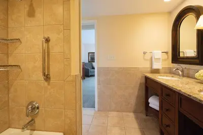 a bathroom with a shower and a sink at Have fun in this 2BD condo in a resort setting with close access to Orlando parks in Orlando