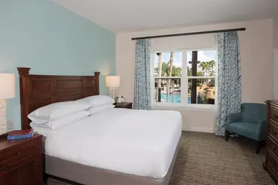 a bedroom with a white bed and a window at Relax after enjoying all the parks Orlando has to offer in this 1BD vacation condo in Orlando