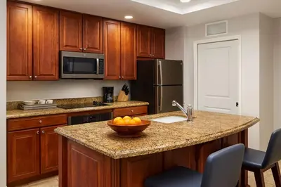 a kitchen with a bowl of fruit on a counter at Relax after enjoying all the parks Orlando has to offer in this 1BD vacation condo in Orlando