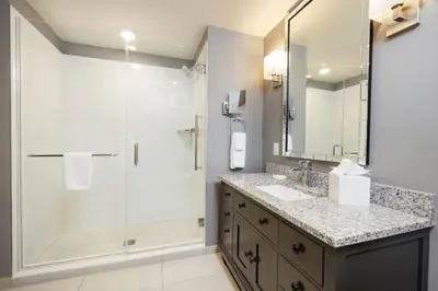 a bathroom with a shower and a sink at WorldMark Kingstown Reef - Studio Sleeps up to 2 in Orlando