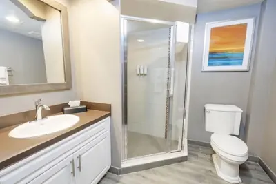 a bathroom with a shower and a toilet and a sink at WorldMark Kingstown Reef - 2BD Sleeps up to 6 in Orlando