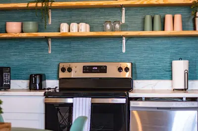 a kitchen with a stove top oven in a kitchen at New APT 15Min Drive Disney and Airport - Parks KingBed Pets in Kissimmee