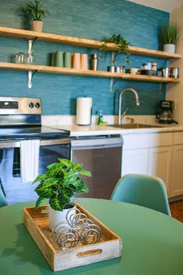 a kitchen with a table with a potted plant on it at New APT 15Min Drive Disney and Airport - Parks KingBed Pets in Kissimmee
