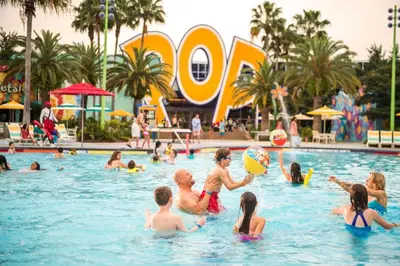 a group of people in a pool at a resort at Disney's Pop Century Resort in Orlando