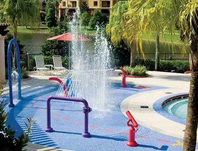 a fountain in the middle of a swimming pool at Beautiful Resort in Bonnet Creek 1BD Deluxe near Walt Disney World in Orlando