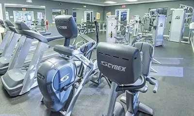 a gym with lots of cardio equipment in it at Beautiful Hotel of Cypress Palms 1BD near Kissimmee Lakefornt Park in Kissimmee