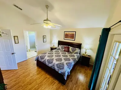 a bedroom with a bed and a ceiling fan at 43 Vacation Home With Private Pool Located At Formosa Gardens!! in Orlando