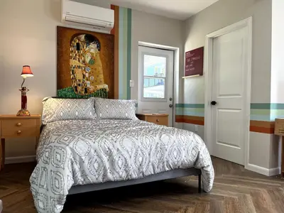 a bedroom with a bed and a window at Downtown Groovy Studio in Orlando