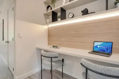 a room with a desk with a laptop on it at Luxury Villa Near Disney and Universal in Kissimmee