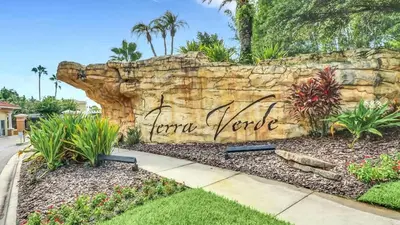 a stone wall with the words karma zone written on it at Summer Getaway - 5-Bedroom Home with Private Pool! in Kissimmee