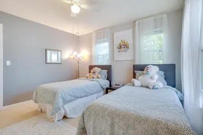 a bedroom with two beds with teddy bears on them at WFH, Relax and Enjoy At-Home Comforts in Orlando in Kissimmee