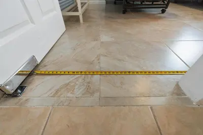 a yellow measuring tape on a tile floor at Wheelchair-Friendly Villa Near Disney World in Orlando