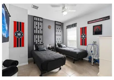 a bedroom with two beds and a couch and a window at Wheelchair-Friendly Villa Near Disney World in Orlando