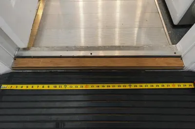 an escalator with a yellow measuring tape on it at Wheelchair-Friendly Villa Near Disney World in Orlando