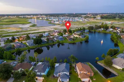 an aerial view of a town with a red marker in the water at Celebrate BR in Orlando