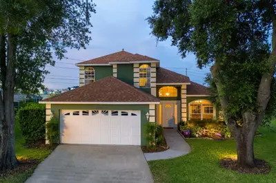 a house with a garage in front of it at Celebrate BR in Orlando