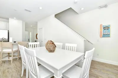 a white dining room with a white table and chairs at Serene Villa Near Disney With Margaritaville Resort & Island H20 Access - 8147Cp in Orlando