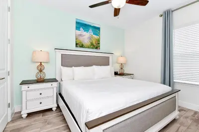 a bedroom with a bed and a ceiling fan at Lovely Villa Cottage Near Disney With Margaritaville Resort & Island H20 Waterpark Access - 2931Cl in Orlando