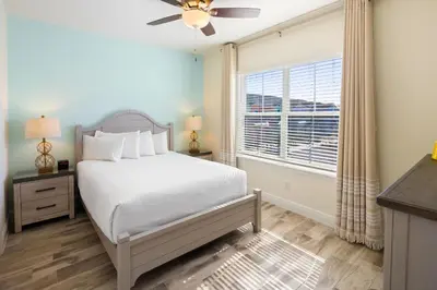 a bedroom with a bed and a window at Lime Green Villa Near Disney With Margaritaville Resort & Island H20 Waterpark Access - 2944Or in Orlando
