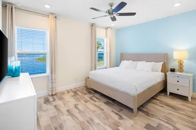 a bedroom with a bed and a ceiling fan at Lime Green Villa Near Disney With Margaritaville Resort & Island H20 Waterpark Access - 2944Or in Orlando