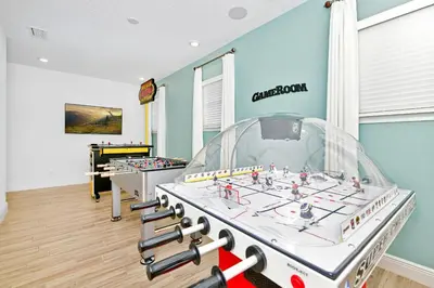a room with a foosball game in a gym at Luxury Cottage Near Disney With Private Pool & Margaritaville Resort And Island H20 Waterpark Access - 3088Ph in Orlando