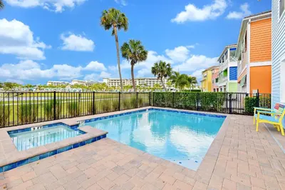a swimming pool with a bench and palm trees at Luxury Cottage Near Disney With Private Pool & Margaritaville Resort And Island H20 Waterpark Access - 3088Ph in Orlando