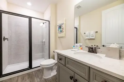 a bathroom with a shower and a toilet and a sink at Spectacular Cottage With Private Pool Near Disney With Margaritaville Resort & Island H2O Access - 8026Kd in Orlando