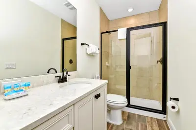 a bathroom with a toilet and a sink and a shower at Perfect Family Villa Near Disney With Margaritaville Resort & Island H20 Waterpark Access - 3168Cs in Orlando