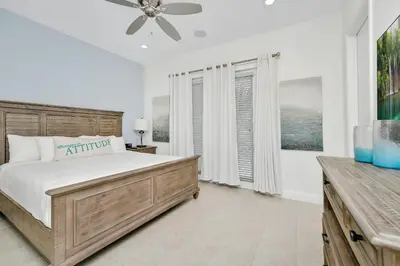 a bedroom with a bed and a ceiling fan at Orange Blossom Special Cottage Near Disney With Private Hot Tub & Island H20 Waterpark Access - 3071Pi in Orlando