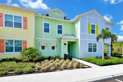 a large house with colorful paint at Paradise Villa Near Disney With Margaritaville Resort & Island H20 Access - 8186Cp in Kissimmee