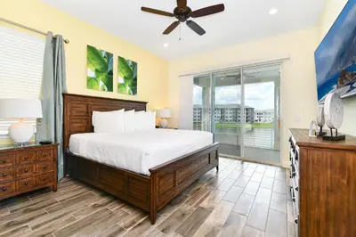 a bedroom with a bed and a window at Waters Edge Cottage Near Disney With Margaritaville Resort & Island H20 Access - 8129Su in Orlando