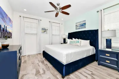 a bedroom with a bed and a ceiling fan at The Tipsy Turtle Cottage With Private Pool Near Disney With Margaritaville Resort & Island H2O Access - 8012St in Orlando